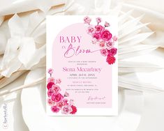 a baby is born announcement with pink flowers