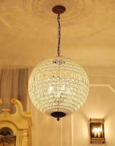 a chandelier hanging from the ceiling in a room