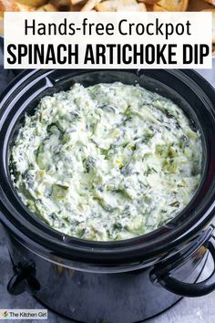 Spinach artichoke dip in a black slow cooker. Title? Hands-free Crockpot Spinach Artichoke Dip Party Appetizers Healthy, Dip Recipes Crockpot, Closet Cooking, Spinach Artichoke Dip Recipe