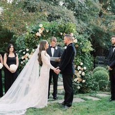 a bride and groom standing at the alter during their wedding ceremony