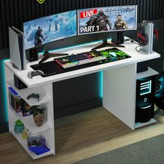 a computer desk with two monitors on top of it and gaming accessories in front of the monitor