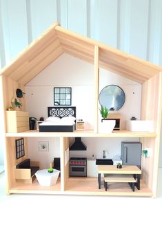 a doll house with furniture and accessories in it