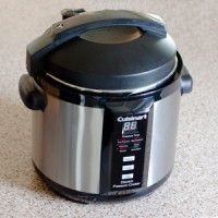 an electric pressure cooker sitting on the floor