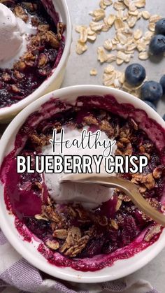 two bowls filled with blueberry crisp and yogurt