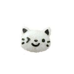 a white stuffed animal with black spots on it's face and eyes, sitting in front of a white background