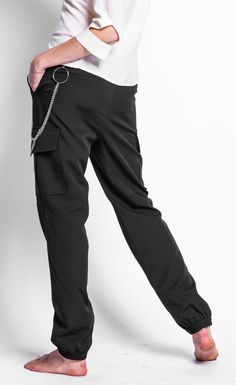 The cargo pant has arrived! These pants come in a relaxed fit with elastic bottoms, slanted pockets, belt loops and defined cargo pockets. Wear yours with a pair of high heeled ankle boots and a turtleneck for a lady-like take on the rustic pant. 100% Polyester High Heeled Ankle Boots, Pink Martini, High Heel Boots Ankle, Cargo Pant, Heeled Ankle Boots, Cargo Pants, Black Pants, Ankle Boots, Turtle Neck