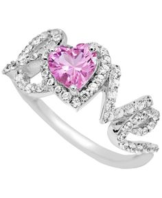 a pink heart shaped ring with white diamonds