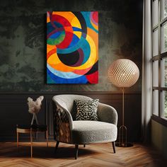 a living room with a chair and painting on the wall