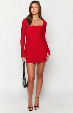 Red long sleeve mini dress

How to style:
Dress to impress in our Lucy red mini dress ()! Perfect for cocktails () or a night out with the girls. Pair with strappy heels and gold jewellery () to look effortlessly chic for your next event. 

Features:


  
 * Light weight material 
 * Long Sleeves 
 * Square neckline 
 * Wrap skirt with an adjustable tie on the left of the bodice 
 * Mini Length 
 * Sheer material 
 * Body lined, arms unlined 
 * Invisible zip on the back Red Full Sleeve Dress, Red Formal Dress Short, Red Long Sleeve Mini Dress, Cocktail Dress Short, Prom Midi Dress, 60's Dress, Red Long Sleeve, Strapless Tops, Sheer Material