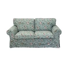 a blue couch with flowers on it