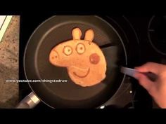 someone is making a giraffe pancake in the shape of a person's face