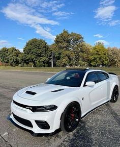 a white car parked in a parking lot