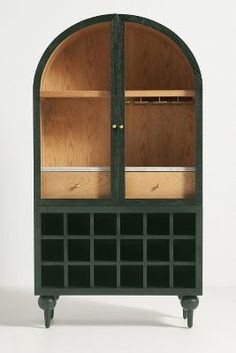 a green cabinet with two doors and shelves on the front, one door is open