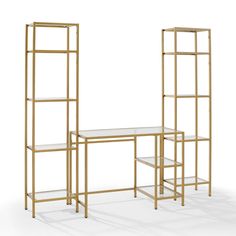 three gold metal shelvings with glass shelves