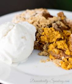 a piece of pie on a white plate with ice cream in the middle and two pieces missing