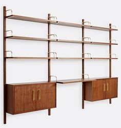 two wooden shelvings with brass handles on each shelf and one has a cabinet