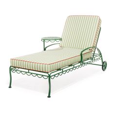 an outdoor chaise lounge chair with green frame and striped fabric on the seat cushion