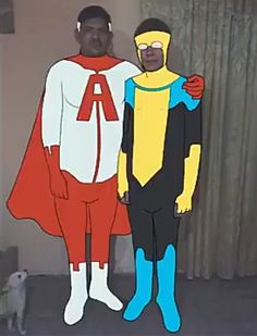 two men in costumes standing next to each other