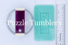 a piece of plastic next to a measuring tape and some other items with the word puzzle tumblers on it