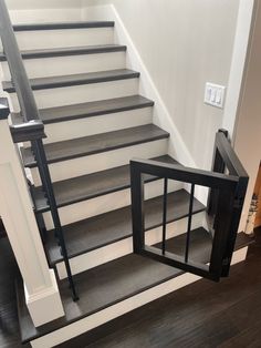 an open door is on the side of a set of stairs in a new home