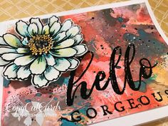 a card with the words hello gorgeous written on it and a large flower in the center