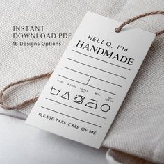 a tag that says hello, i'm handmade on the side of a pillow