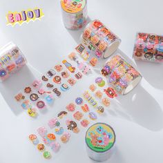 various stickers and decorations are arranged on a white surface with the words hello kitty