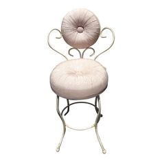 a white chair with a circular back and seat cushion on it's armrests