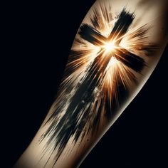 a cross tattoo on the arm with paint splatters and light coming from it