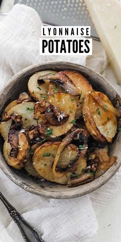 a bowl filled with cooked potatoes on top of a table