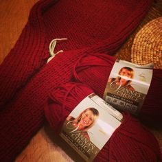 two skeins of red yarn sitting next to each other