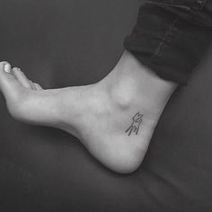 a person with a small tattoo on their foot