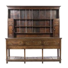 an old wooden desk with drawers and shelves