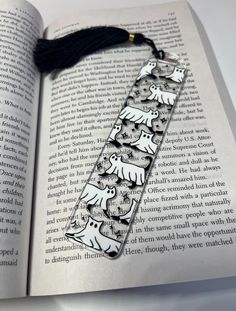 the bookmark is decorated with dogs and cats