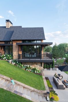 a house with an outdoor patio and stairs leading up to it