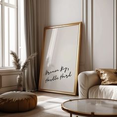 a living room with a couch, coffee table and large framed poster on the wall