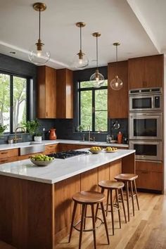 a large kitchen with wooden cabinets and white counter tops, along with three stools in front of the island