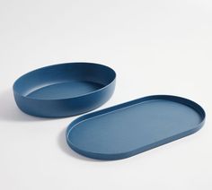 two blue oval trays sitting next to each other