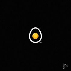 an egg sitting in the middle of a black background with white circles on it's side