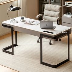 an office desk with a laptop on it