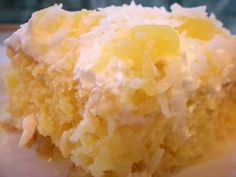 a close up of a piece of cake on a plate with frosting and icing