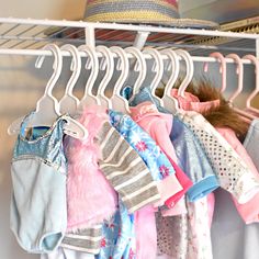 a rack with clothes and hats hanging on it