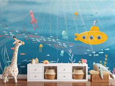 an underwater scene wall mural in a child's room with stuffed animals and toys