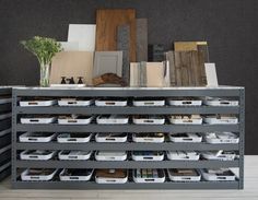 the shelves are filled with many different types of boxes and containers on top of each other