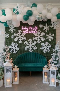 Cozy winter-themed baby shower backdrop featuring a neon "Baby it's cold outside" sign, large white snowflakes, and a teal velvet sofa. The scene is adorned with green and white balloons, frosted trees, and glowing lanterns, perfect for a January baby shower. The setup creates a warm and inviting atmosphere ideal for winter baby shower themes. January Baby Shower Ideas, January Baby Shower Themes, January Baby Shower, Gender Reveal Unique, January Baby, Unique Themes, Gender Reveal Themes, Themes Ideas, Winter Wonderland Theme