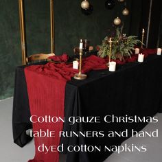 an image of a table setting with candles and christmas decorations on the tablescloths