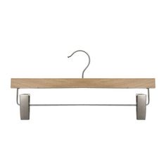 a wooden and metal hanger on a white background