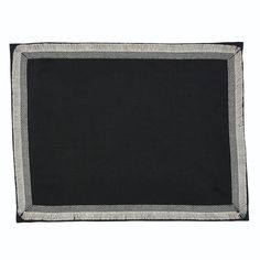 a black and white placemat on a white background with an embroidered border around the edges