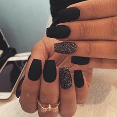 MATTE BLACK NAILS FOR 2017 They’re simple, elegant, and classic. You can’t go far wrong with matte black nails, and when you throw that shimmer-glitter one in for good measure, you have the perfect matte nail designs for fall and winter. We’re certainly adding them to our wish-list for this season! Matte Black Nails, Matte Nails Design, Colorful Nails, Black Nail, Accent Nails, Matte Nails