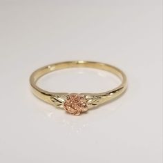 "Thanks for shopping our vintage estate store. We tend to sell well below wholesale and truly hope you enjoy all of our items. Many of the items are one of a kind, so please enjoy scrolling through the pictures and hopefully something will catch your eye. Brown spots are from the camera or reflections. Estate 10k yellow rose gold leaf rose ring. Looks like a Black Hills Gold ring, but not marked as such.  Has yellow rose gold leaves on each side. Ring size: 7 Setting: 1/4\" 4mm Band width: 1.5mm Vintage 14k Gold Flower Promise Ring, Vintage Gold Flower Promise Ring, Vintage Style Gold Flower Promise Ring, Gold Vintage Style Flower Promise Ring, Vintage 14k Rose Gold Flower Ring, Vintage 14k Gold Flower Ring, Vintage Yellow Gold Flower Ring For Promise, Vintage Yellow Gold Flower Promise Ring, Vintage Rose Gold 14k Gold Flower Ring